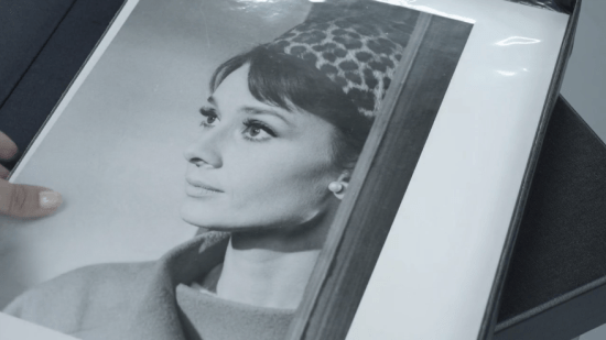 Promotional still of Hepburn in Charade on display in Christie's promotional video